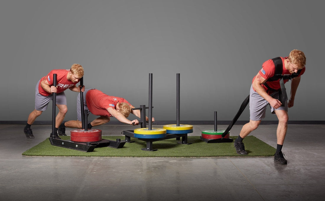 Athlete pushes and pull a sled.