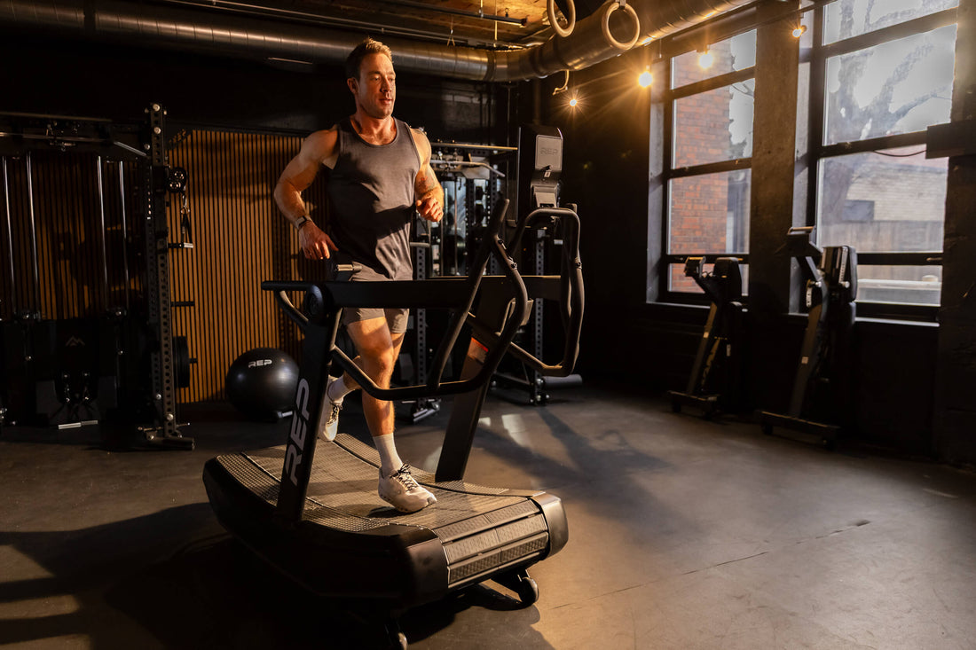 Athlete runs on the Strive™ Curved Treadmill.