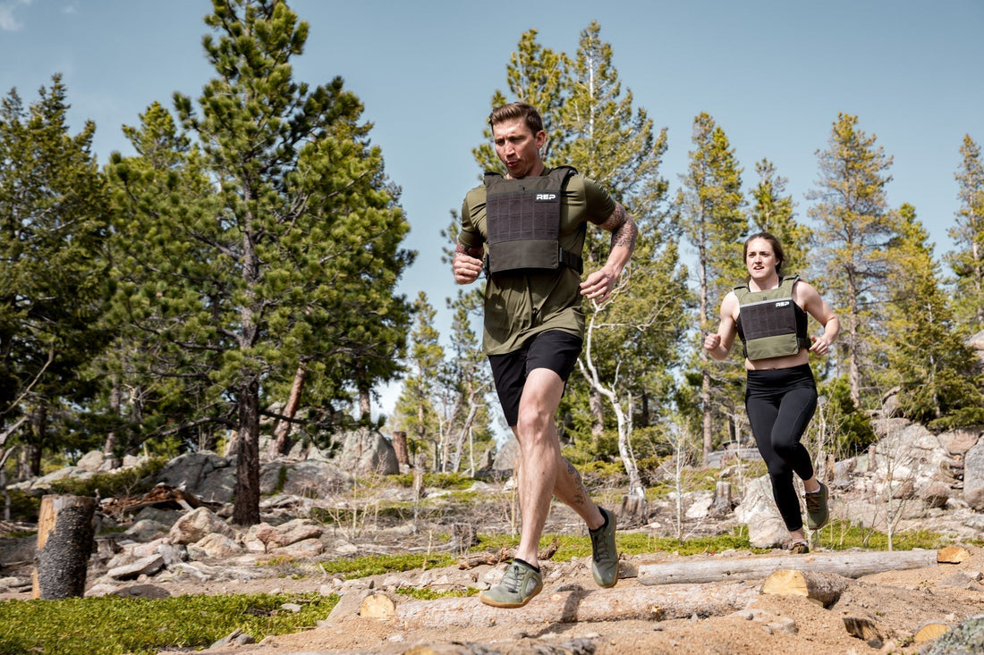 People running in weighted vests