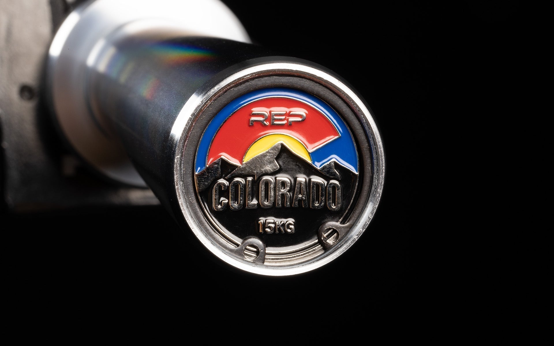 15 kg Colorado Bar weightlifting bar closeup of chrome coloured detailing at end of bar, ideal for strength training and gym workouts from Rep Fitness UK | Shop Premium Gym Equipment for Home & Commercial Use Online| Best Online Gym Equipment UK