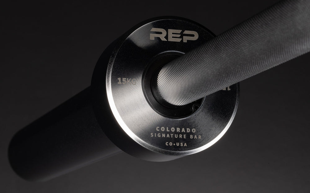 15 kg Colorado Bar weightlifting bar closeup of chrome metal detailing, ideal for strength training and gym workouts from Rep Fitness UK | Shop Premium Gym Equipment for Home & Commercial Use Online| Best Online Gym Equipment UK