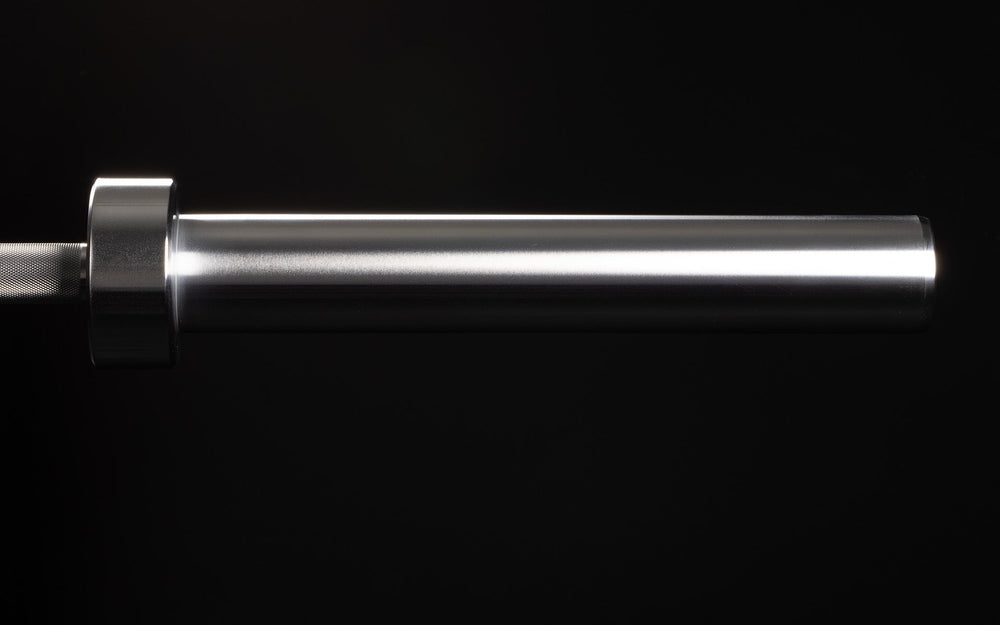 15 kg Colorado Bar weightlifting bar closeup of chrome metal end of bar, ideal for strength training and gym workouts from Rep Fitness UK | Shop Premium Gym Equipment for Home & Commercial Use Online | Best Online Gym Equipment UK