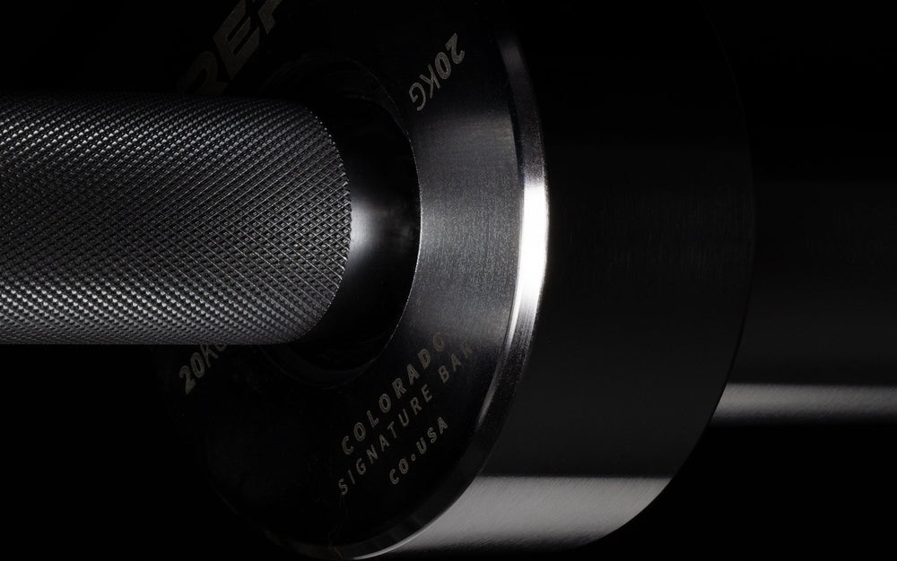 20 kg Colorado Bar weightlifting bar closeup of chrome metal detailing with Colorado place of origin, ideal for strength training and gym workouts from Rep Fitness UK | Shop Premium Gym Equipment for Home & Commercial Use Online
