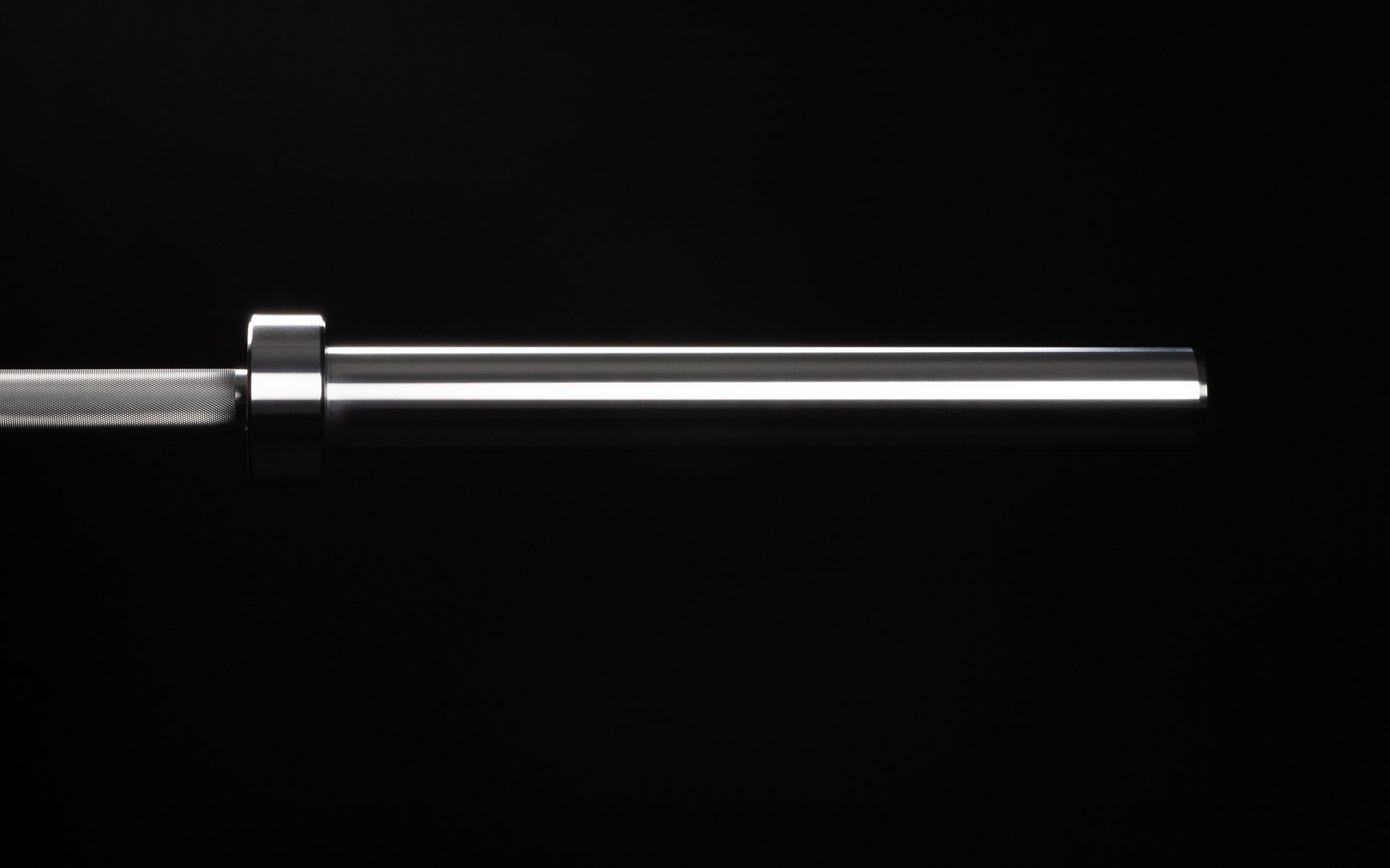 20 kg Colorado Bar weightlifting bar closeup of chrome metal sleeve end of bar, ideal for strength training and gym workouts from Rep Fitness UK | Shop Premium Gym Equipment for Home & Commercial Use Online