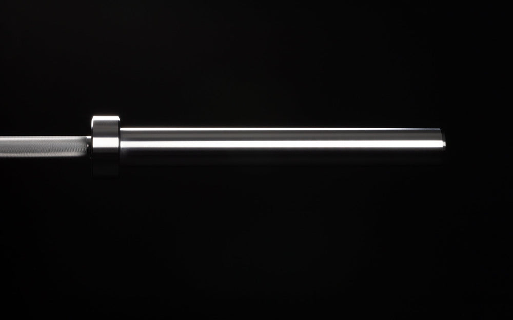 20 kg Colorado Bar weightlifting bar closeup of chrome metal sleeve end of bar, ideal for strength training and gym workouts from Rep Fitness UK | Shop Premium Gym Equipment for Home & Commercial Use Online