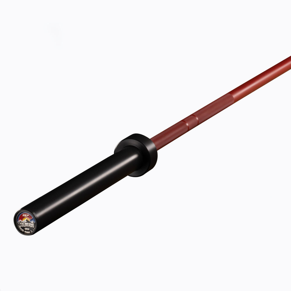 20 kg Colorado Bar weightlifting bar with a sleek red metal finish, ideal for strength training and gym workouts from Rep Fitness UK | Shop Premium Gym Equipment for Home & Commercial Use Online