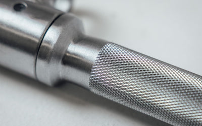 Close up of Knurled Texture on the 25'' Straight Bar from Rep Fitness UK | Shop Best Premium Gym Equipment for Home & Commercial Use Online