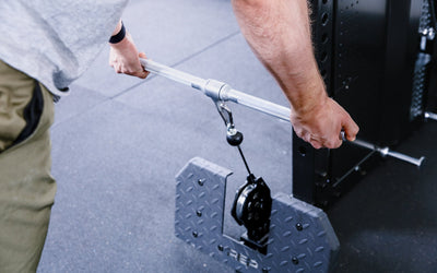 25'' Straight Bar attached to cable on a functional trainer from Rep Fitness UK | Shop Best Premium Gym Equipment for Home & Commercial Use Online