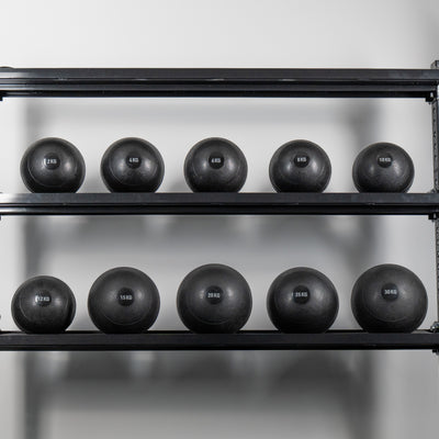 Rep Fitness UK slam ball set displayed on two-tier storage rack