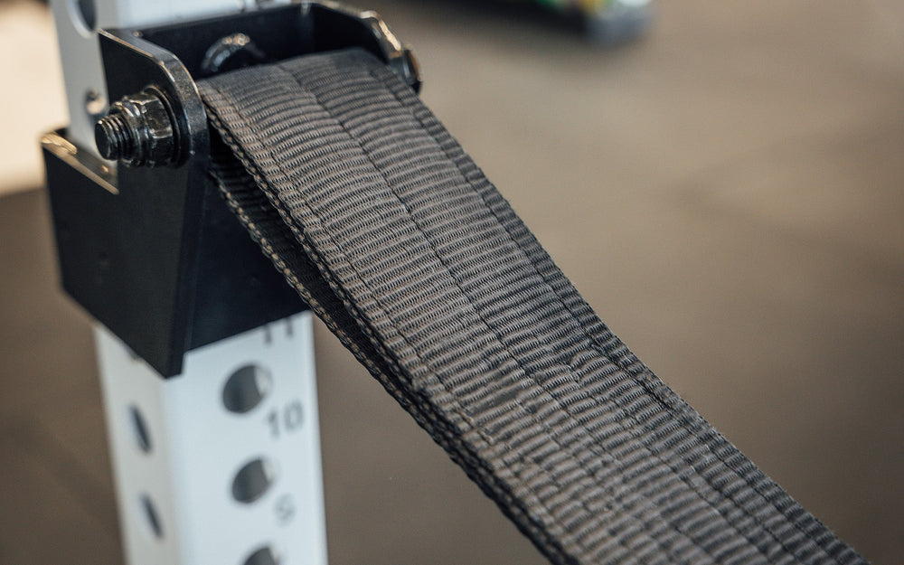 5000 Strap Safeties 2.0 Close Up of Bracket and Strap, heavy-duty reinforced nylon safety straps for PR-5000, Omni, and 1000 Series power racks; ultra-durable, barbell-protecting, noise-reducing design with 1,000lb capacity, adjustable height ends, and patent-pending anti-rotation brackets for safe and versatile strength training from Rep Fitness UK | Shop Premium Gym Equipment for Home & Commercial Use, Best Online Gym Equipment