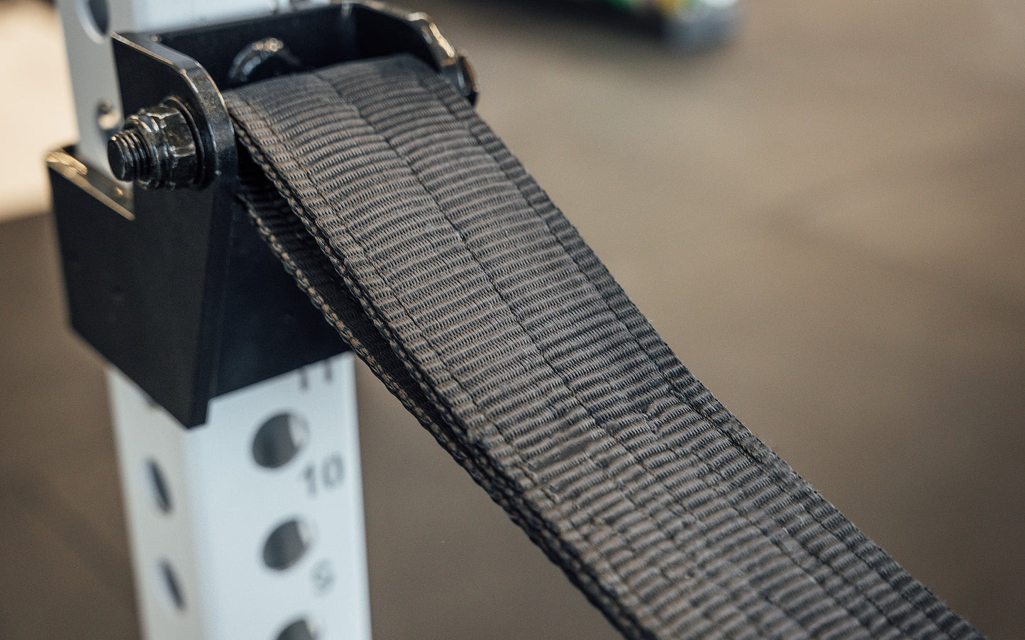 5000 Strap Safeties 2.0 Close Up of Bracket and Strap, heavy-duty reinforced nylon safety straps for PR-5000, Omni, and 1000 Series power racks; ultra-durable, barbell-protecting, noise-reducing design with 1,000lb capacity, adjustable height ends, and patent-pending anti-rotation brackets for safe and versatile strength training from Rep Fitness UK | Shop Premium Gym Equipment for Home & Commercial Use, Best Online Gym Equipment