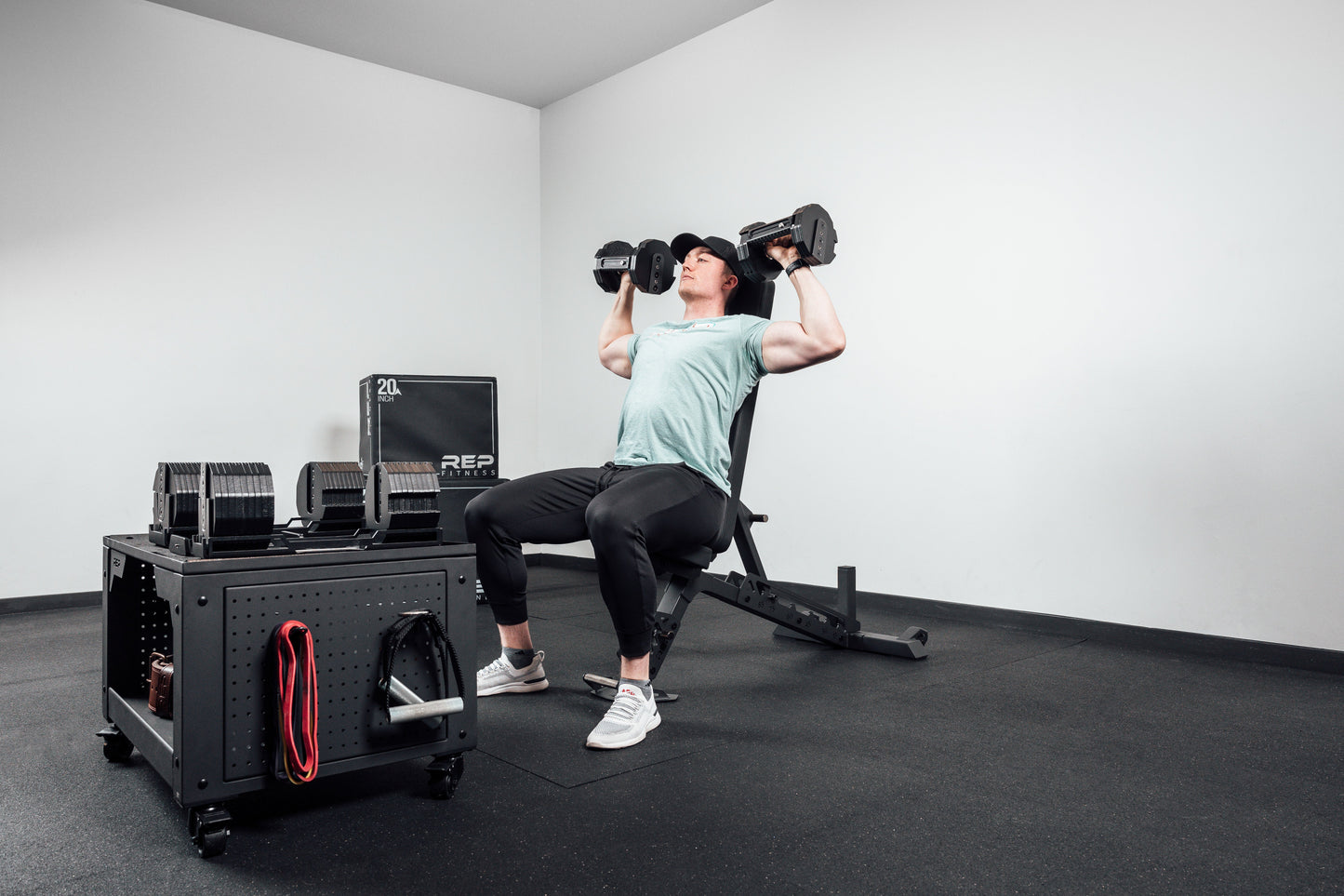 AB-4100 Adjustable Weight Bench in use for dumbbell overhead press from Rep Fitness UK | Shop Best Premium Gym Equipment for Home & Commercial Use Online