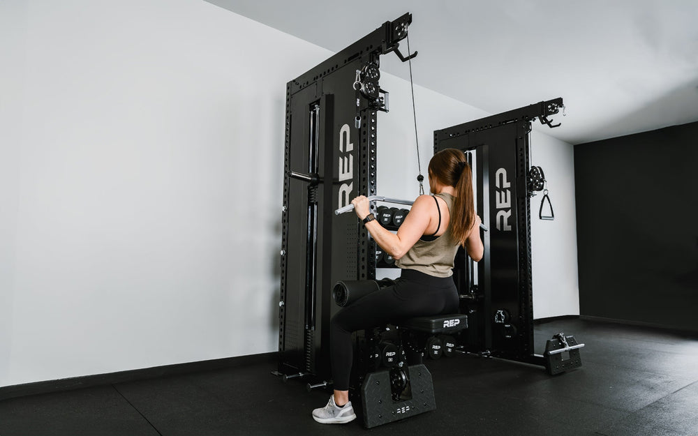 Woman sitting on Pegasus™ Attachment added to Adonis from Rep Fitness UK | Shop Premium Gym Equipment for Home & Commercial Use, Best Online Gym Equipment UK