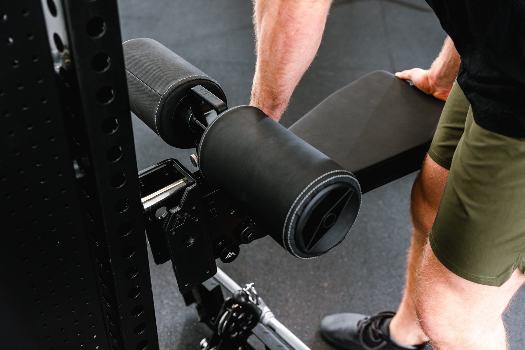 Man adjusting seat pad on Pegasus™ Attachment added to Adonis from Rep Fitness UK | Shop Premium Gym Equipment for Home & Commercial Use, Best Online Gym Equipment UK