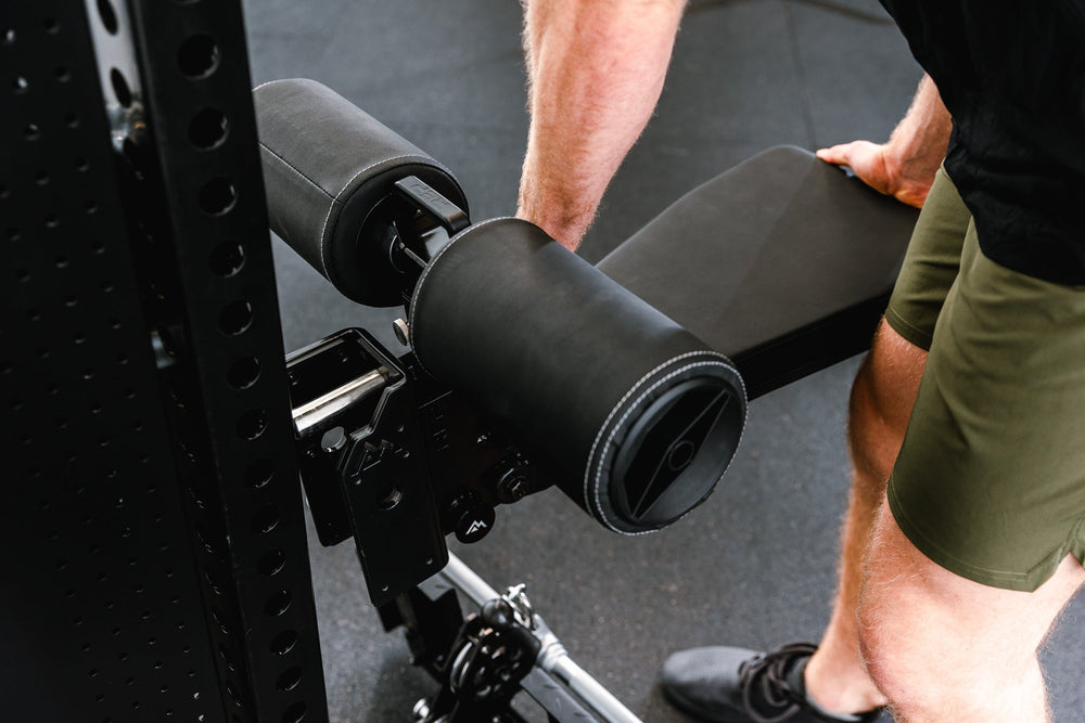 Man adjusting seat pad on Pegasus™ Attachment added to Adonis from Rep Fitness UK | Shop Premium Gym Equipment for Home & Commercial Use, Best Online Gym Equipment UK