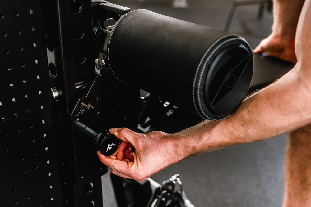 Man adjusting seating position on Pegasus™ Attachment added to Adonis from Rep Fitness UK | Shop Premium Gym Equipment for Home & Commercial Use, Best Online Gym Equipment UK