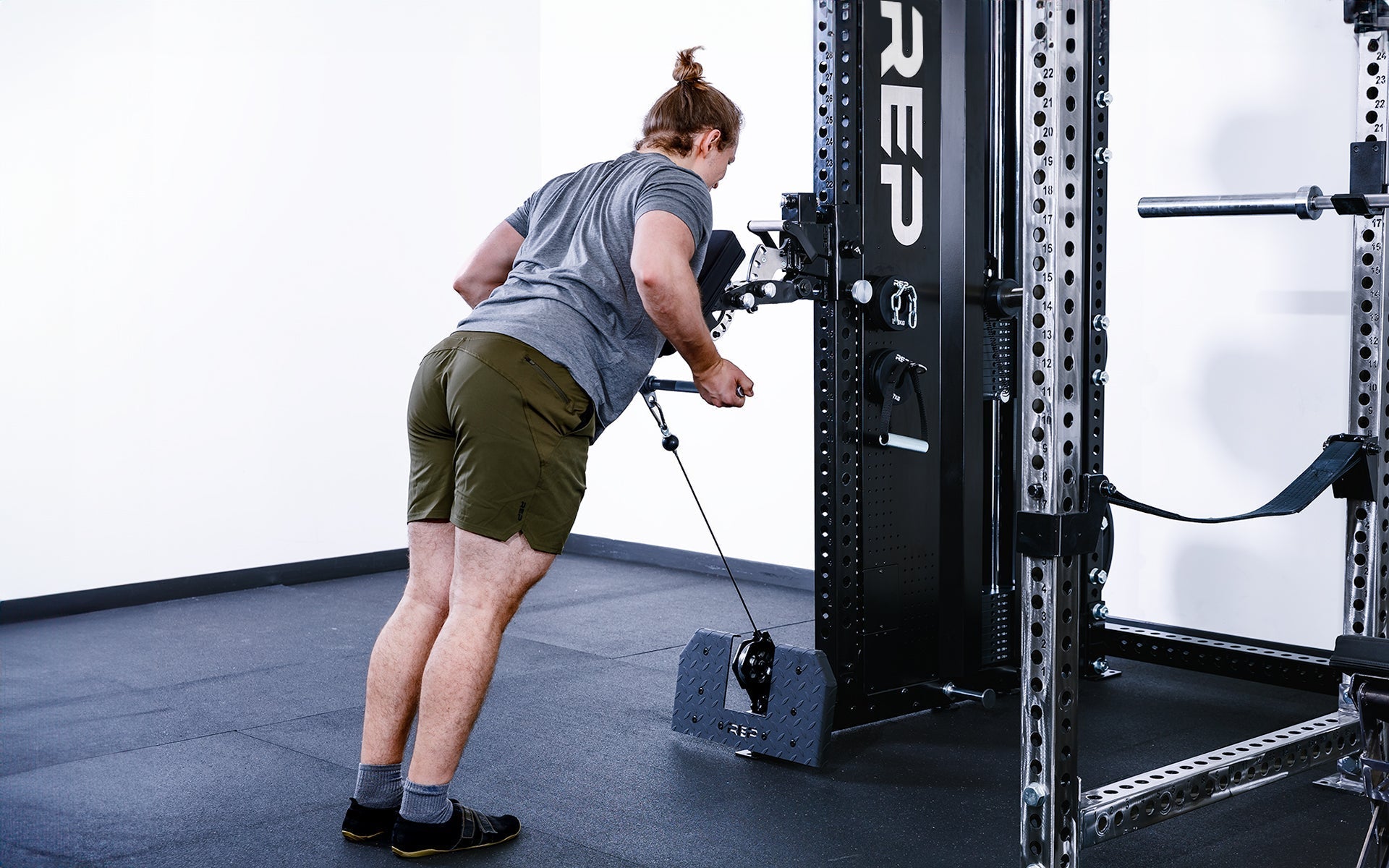 man doing arm exercises leaning against Pegasus™ Attachment added to Adonis from Rep Fitness UK | Shop Premium Gym Equipment for Home & Commercial Use, Best Online Gym Equipment UK