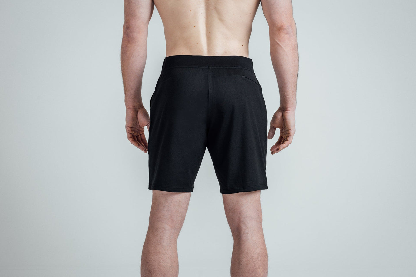 Rear shot of REP’s Men’s Apollo Shorts with a 9 inch inseam in Heather Black/Cool Gray on an athlete