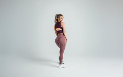 Back shot of an athlete wearing the REP Rhea Tank in Wine