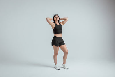 Full body shot: Athlete striking a pose in the Black Women’s Artemis Shorts