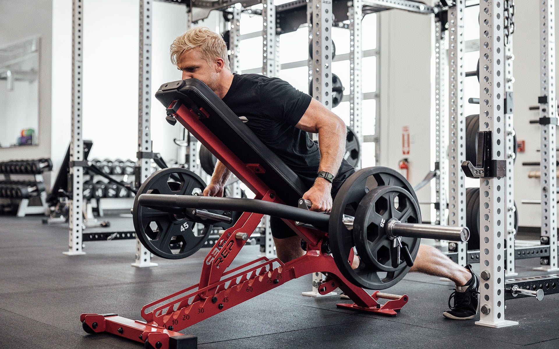 Open Trap Bar with wide handles standing vertically on its integrated deadlift jack.