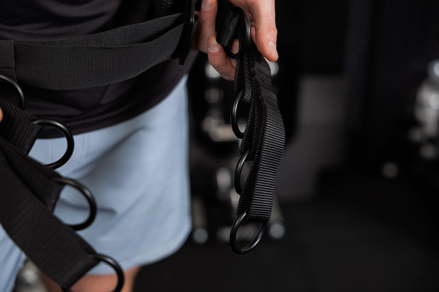 Person wearing the belt squat belt showing the o-rings for different length options from Rep Fitness UK | Shop Best Premium Gym Equipment for Home & Commercial Use Online