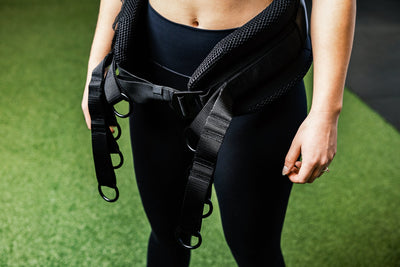 Person wearing the belt squat belt showing the o-rings for different length options from Rep Fitness UK | Shop Best Premium Gym Equipment for Home & Commercial Use Online