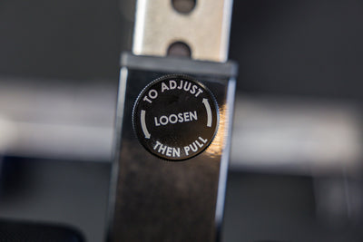 Close-up shot of the adjustment pin on the Adjustable Bench Leg Roller from Rep Fitness UK | Shop Best Premium Gym Equipment for Home & Commercial Use Online