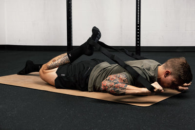 Person using stretching band for quad stretches from Rep Fitness UK | Shop Best Premium Gym Equipment for Home & Commercial Use Online