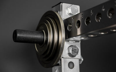 Rep Fitness Calibrated Steel Plates (KG) loaded on a weight horn, highlighting a calibrated tolerance from Rep Fitness UK | Shop Best Premium Gym Equipment for Home & Commercial Use Online