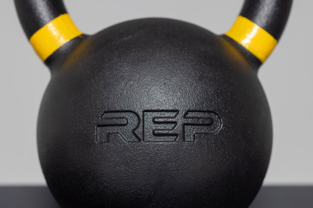 Close-up of 16kg kettlebell – premium cast-iron kettlebell from with color-coded handle, textured black coating for superior grip, and flat bases for stability; ideal for strength, conditioning, and full-body training; available individually or in sets from Rep Fitness UK | Shop Premium Gym Equipment for Home & Commercial Use, Best Online Gym Equipment UK