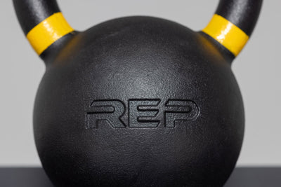 Close-up of 16kg kettlebell – premium cast-iron kettlebell from with color-coded handle, textured black coating for superior grip, and flat bases for stability; ideal for strength, conditioning, and full-body training; available individually or in sets from Rep Fitness UK | Shop Premium Gym Equipment for Home & Commercial Use, Best Online Gym Equipment UK