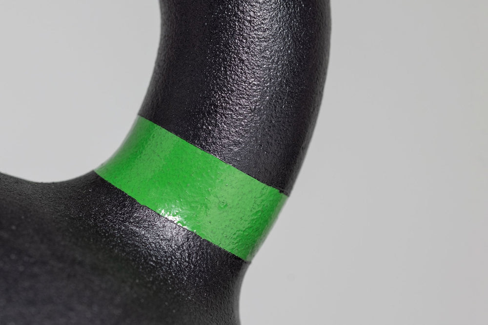 Close-up of 20kg green marking  on kettlebell – premium cast-iron kettlebell from with color-coded handle, textured black coating for superior grip, and flat bases for stability; ideal for strength, conditioning, and full-body training; available individually or in sets from Rep Fitness UK | Shop Premium Gym Equipment for Home & Commercial Use, Best Online Gym Equipment UK