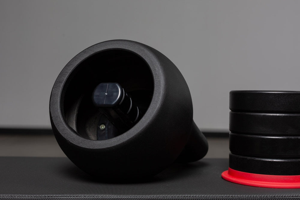 Close-up of 8-16kg adjustable kettlebell with weights removed from Rep Fitness UK, quick weight adjustment, non-slip matte powder coat, rubber base, and versatile for home gyms| Shop Premium Gym Equipment for Home & Commercial Use, Best Online Gym Equipment UK