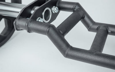 Close-up of Cambered Swiss Bar, premium chrome sleeve with REP logo, versatile multi-grip barbell with cambered design for greater range of motion and muscle engagement; features moderate knurling, round tubing for comfort, removable eyebolt for cable attachments, standard collar compatibility, and premium construction for advanced strength training from Rep Fitness UK | Shop Premium Gym Equipment for Home & Commercial Use, Best Online Gym Equipment