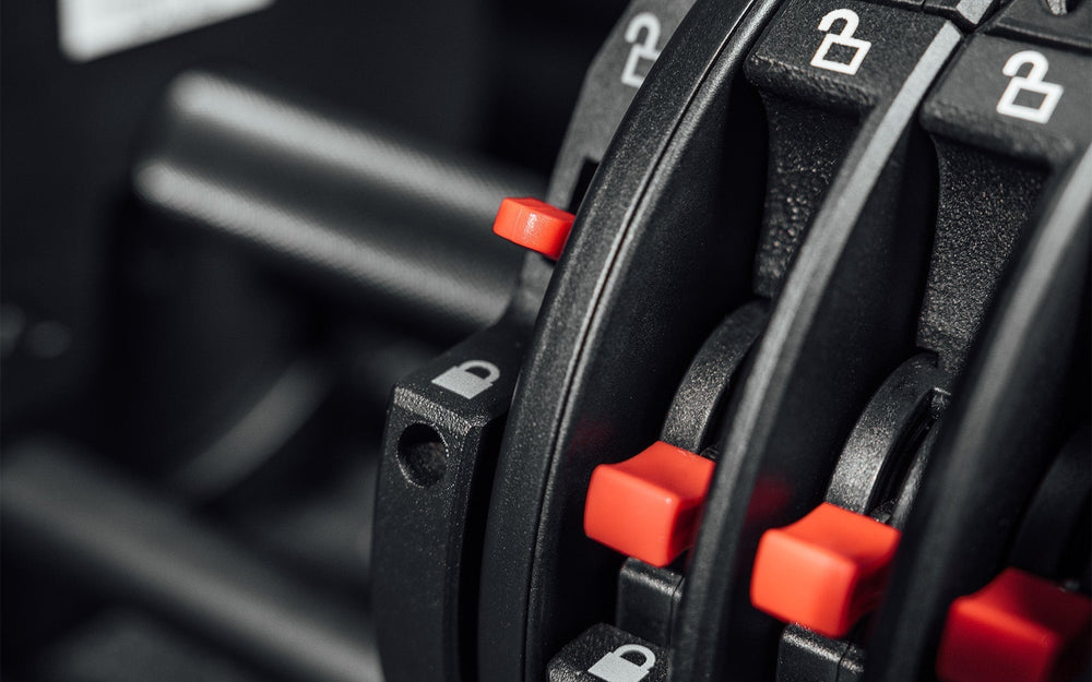 Close-up of secure Lock-N-Load switches on high quality QuickDraw dumbbells  from Rep Fitness UK | Shop Premium Gym Equipment for Home & Commercial Use, Best Online Gym Equipment UK