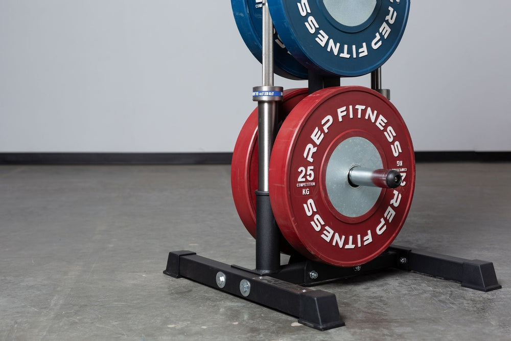 Close-up view of the bottom section of the REP Bar and Weight Plate Tree loaded with a pair of 25kg REP Competition Bumper Plates and two barbells. Two barbell holders, heavy-duty storage for easy access in home and commercial fitness spaces from  Rep Fitness UK | Shop Premium Gym Equipment for Home & Commercial Use Online | Best Gym Equipment UK