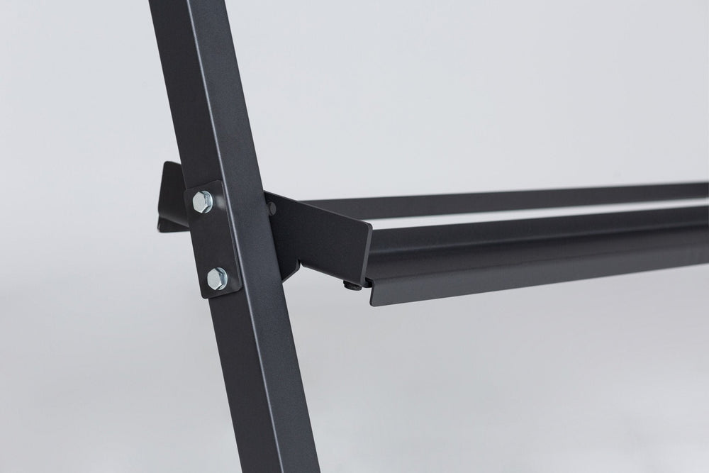 Close-up view of the left support post and the middle shelf of a REP. support post and top shelf of a REP Dumbbell Rack. Close-up side view of the bottom of the 3-tiered matte black REP Dumbbell Rack showcasing the "REP" logo, bottom shelf, and rubber foot. 3-tiered matte black REP Dumbbell Rack storing a 5-50 REP dumbbell set, heavy-duty three-tier dumbbell rack with durable 11-gauge steel shelves, compact footprint, and 1" lip for secure storage  fits REP rubber hex and urethane dumbbells, Dumbbell Rack.