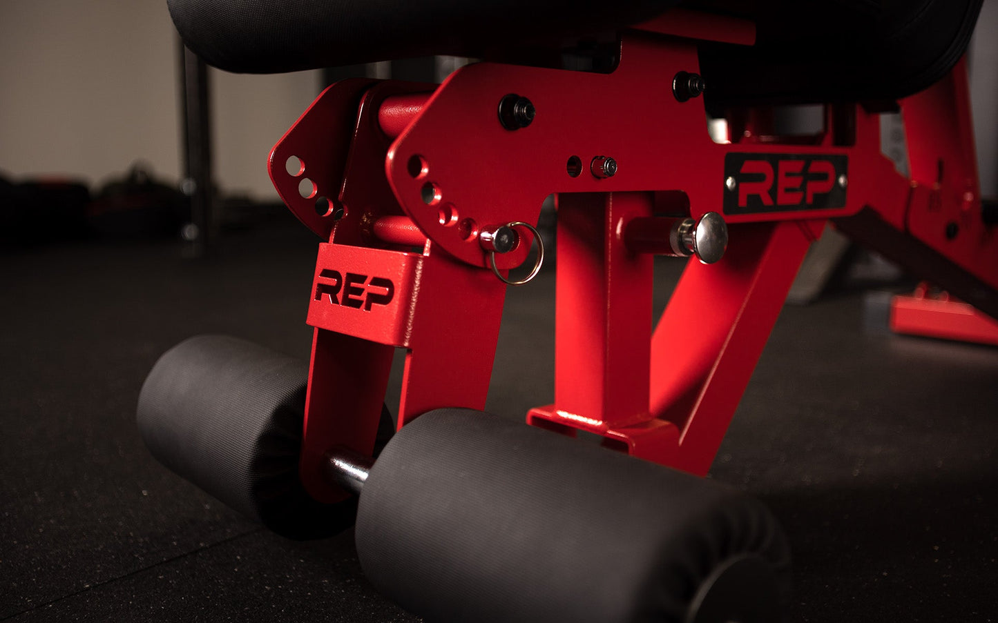 REP Fitness UK AB-3000 2.0 adjustable bench close-up of leg roller attachment with locking adjustment pin from Rep Fitness UK | Shop Best Premium Gym Equipment for Home & Commercial Use Online