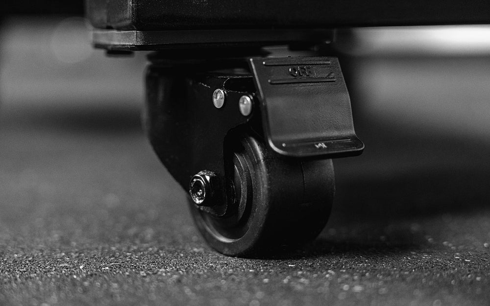 Close up of high-capacity caster wheel on heavy-duty multipurpose cart  storage solution in sleek matte black metal finish for organized gym equipment storage from Rep Fitness UK | Shop Premium Gym Equipment for Home & Commercial Use Online