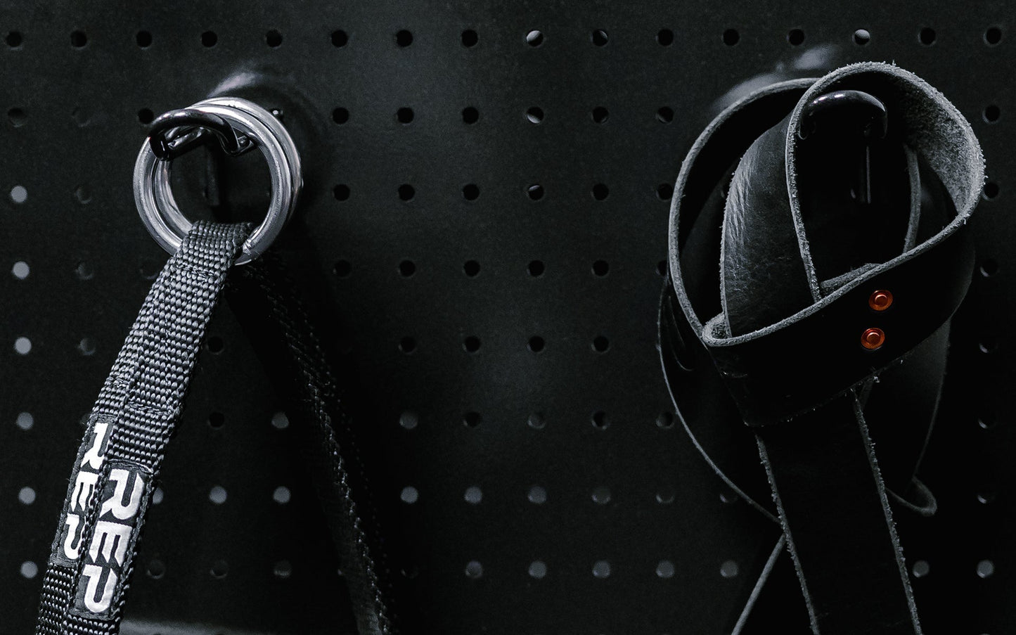 Close up of pulley handle and strap hanging from heavy-duty multipurpose cart  storage solution in sleek matte black metal finish for organized gym equipment storage from Rep Fitness UK | Shop Premium Gym Equipment for Home & Commercial Use Online