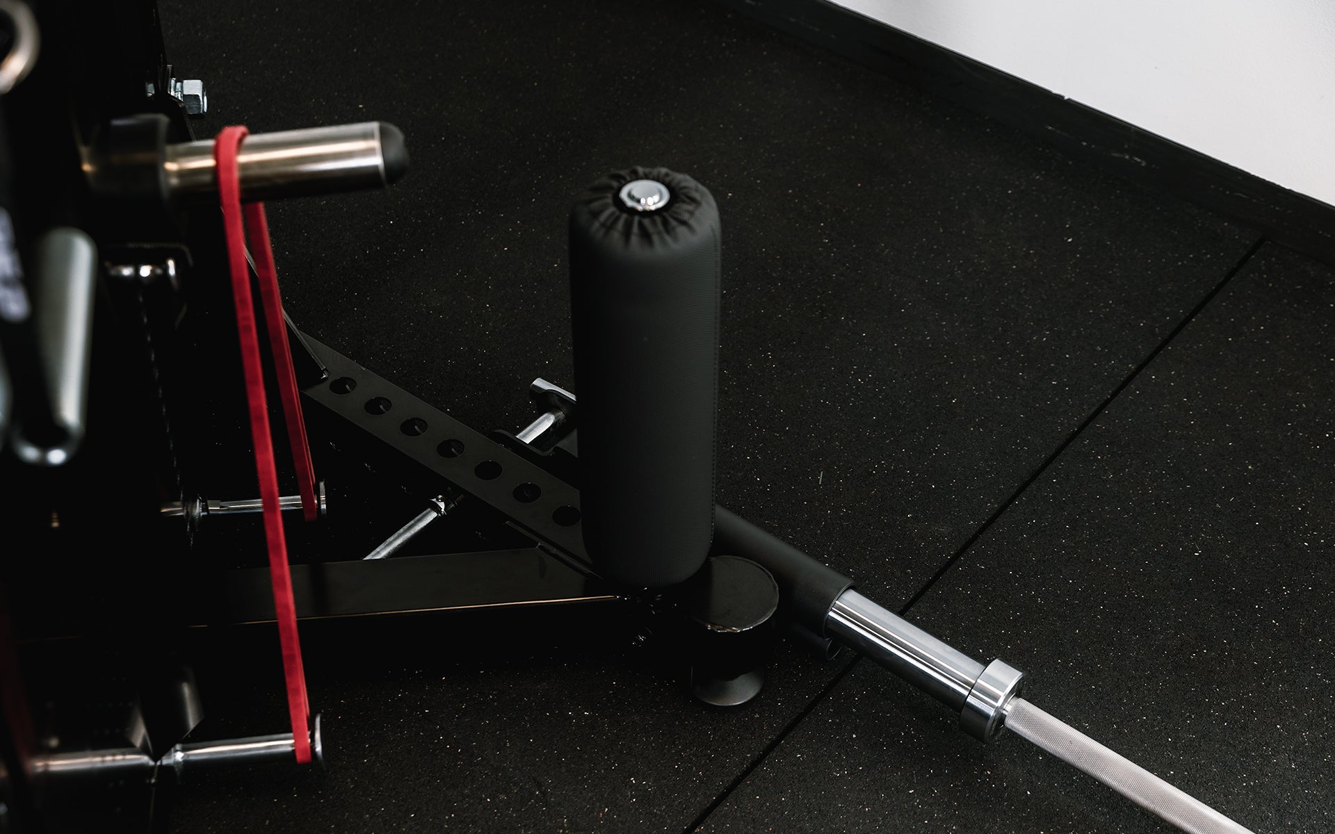 Closeup of leg roll on Adonis™ Cable Tower. Close up of hooks at the top to hold attachment, Adonis™ Cable Tower plate loaded, Selectorized with base support, premium space-saving cable machine for home or commercial gyms, 1:1 and 2:1 pulley ratios, 34 cable positions, and compatibility with REP’s 5000 Series racks, Pegasus™ attachment, and Modular Storage System for unmatched versatility and performance from Rep Fitness UK | Shop Premium Gym Equipment for Home & Commercial Use, Best Online Gym Equipment UK