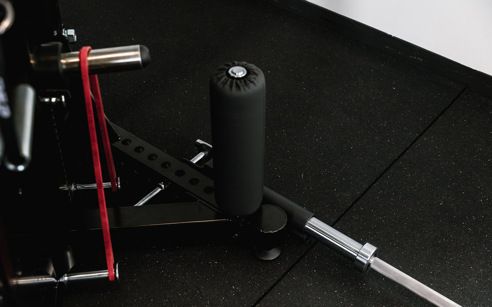 Closeup of leg roll on Adonis™ Cable Tower. Close up of hooks at the top to hold attachment, Adonis™ Cable Tower plate loaded, Selectorized with base support, premium space-saving cable machine for home or commercial gyms, 1:1 and 2:1 pulley ratios, 34 cable positions, and compatibility with REP’s 5000 Series racks, Pegasus™ attachment, and Modular Storage System for unmatched versatility and performance from Rep Fitness UK | Shop Premium Gym Equipment for Home & Commercial Use, Best Online Gym Equipment UK