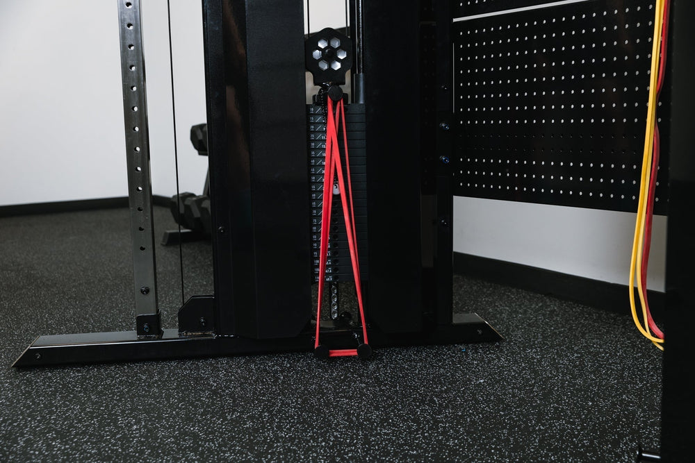 Closeup of resistance bands on Arcadia™ max stand-alone functional trainer, premium full-sized cable machine with grips hanging on the back board from Rep Fitness UK | Shop Premium Gym Equipment for Home & Commercial Use Online.
