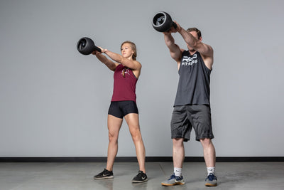Couple Exercising with adjustable kettlebells from Rep Fitness UK, quick weight adjustment, non-slip matte powder coat, rubber base, and versatile for home gyms| Shop Premium Gym Equipment for Home & Commercial Use, Best Online Gym Equipment UK