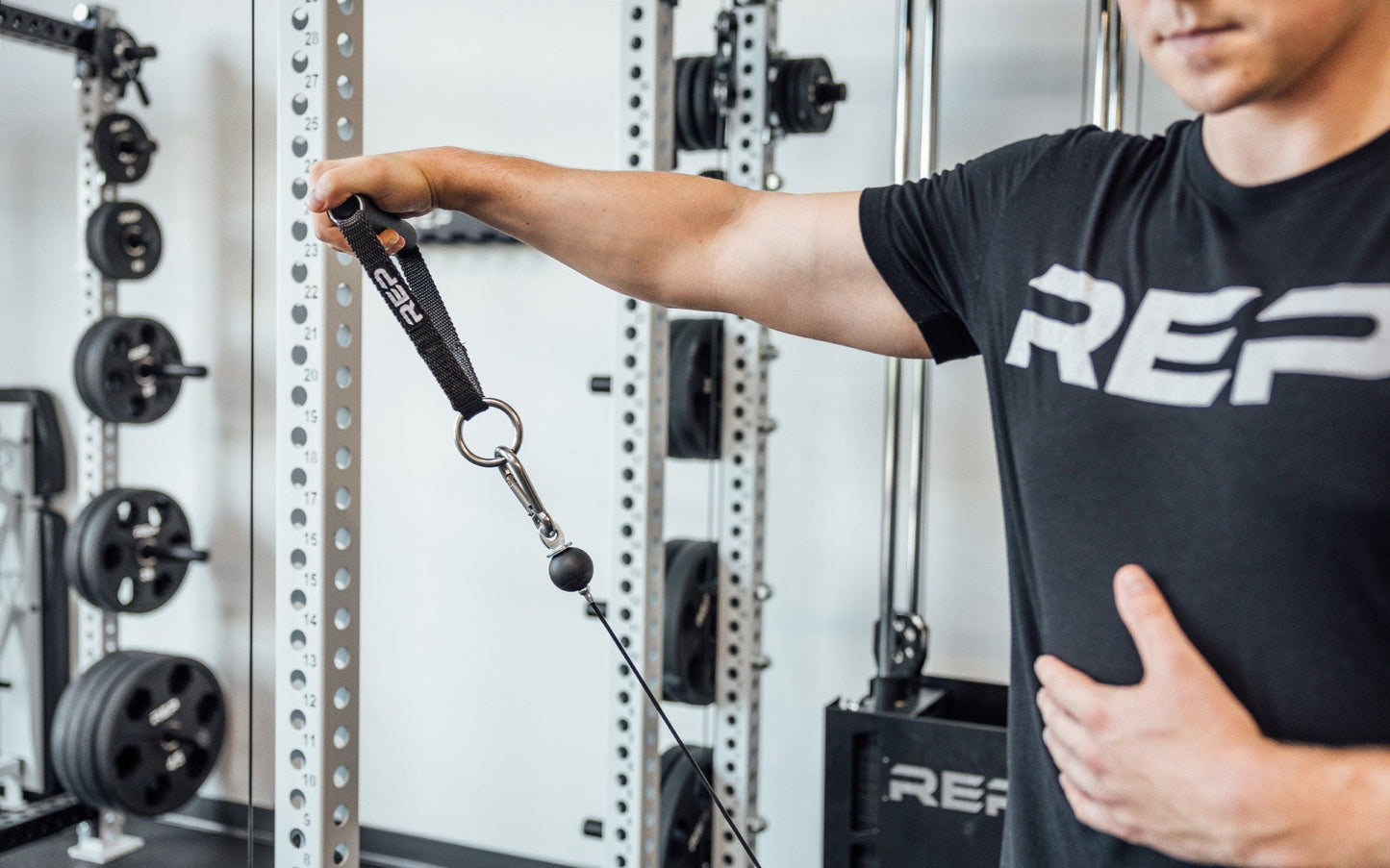 D-handle being used for cable side raise from Rep Fitness UK | Shop Best Premium Gym Equipment for Home & Commercial Use Online