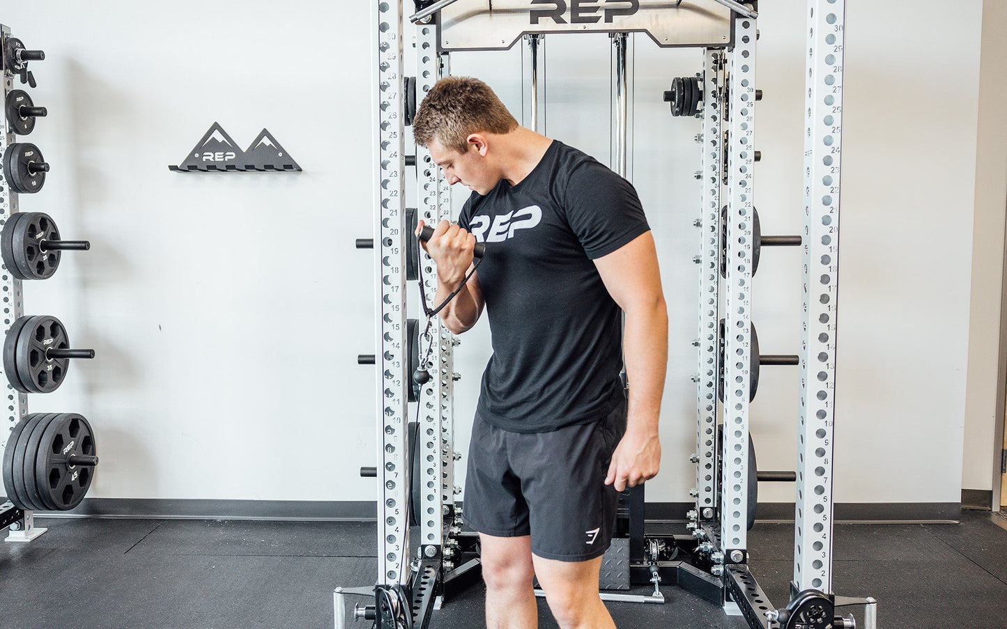 D-handle being used for bicep curl from Rep Fitness UK | Shop Best Premium Gym Equipment for Home & Commercial Use Online