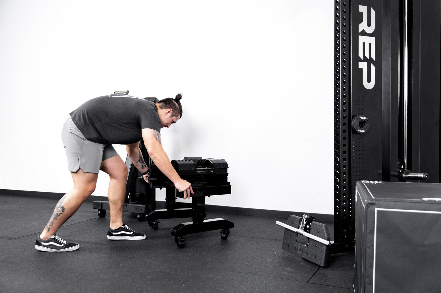 Dumbbell Stand Metallic Black Man Pushing from_Rep_Fitness_UK_Shop_Premium_Gym_Equipment_for_Home_Commercial_Use_Online