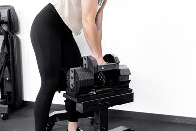 Dumbbell Stand Metallic Black Woman Lifting Dumbbell from_Rep_Fitness_UK_Shop_Premium_Gym_Equipment_for_Home_Commercial_Use_Online