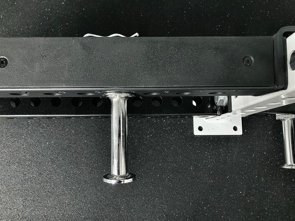 From above view of Flip-Down Safeties on PR-5000 Power Rack, heavy-duty 11-gauge steel safety arms for power racks; 1,000 lb and 700 lb capacities, quick-lock clevis pin design, protective liners for barbell and uprights, and 1” side holes compatible with Leg Roller, Utility Horn, and Band Peg attachments rom Rep Fitness UK | Shop Premium Gym Equipment for Home & Commercial Use, Best Online Gym Equipment UK